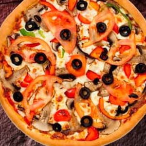 Golden Pizza Cafe veg mix pizza with olives, capsicum and tomato
